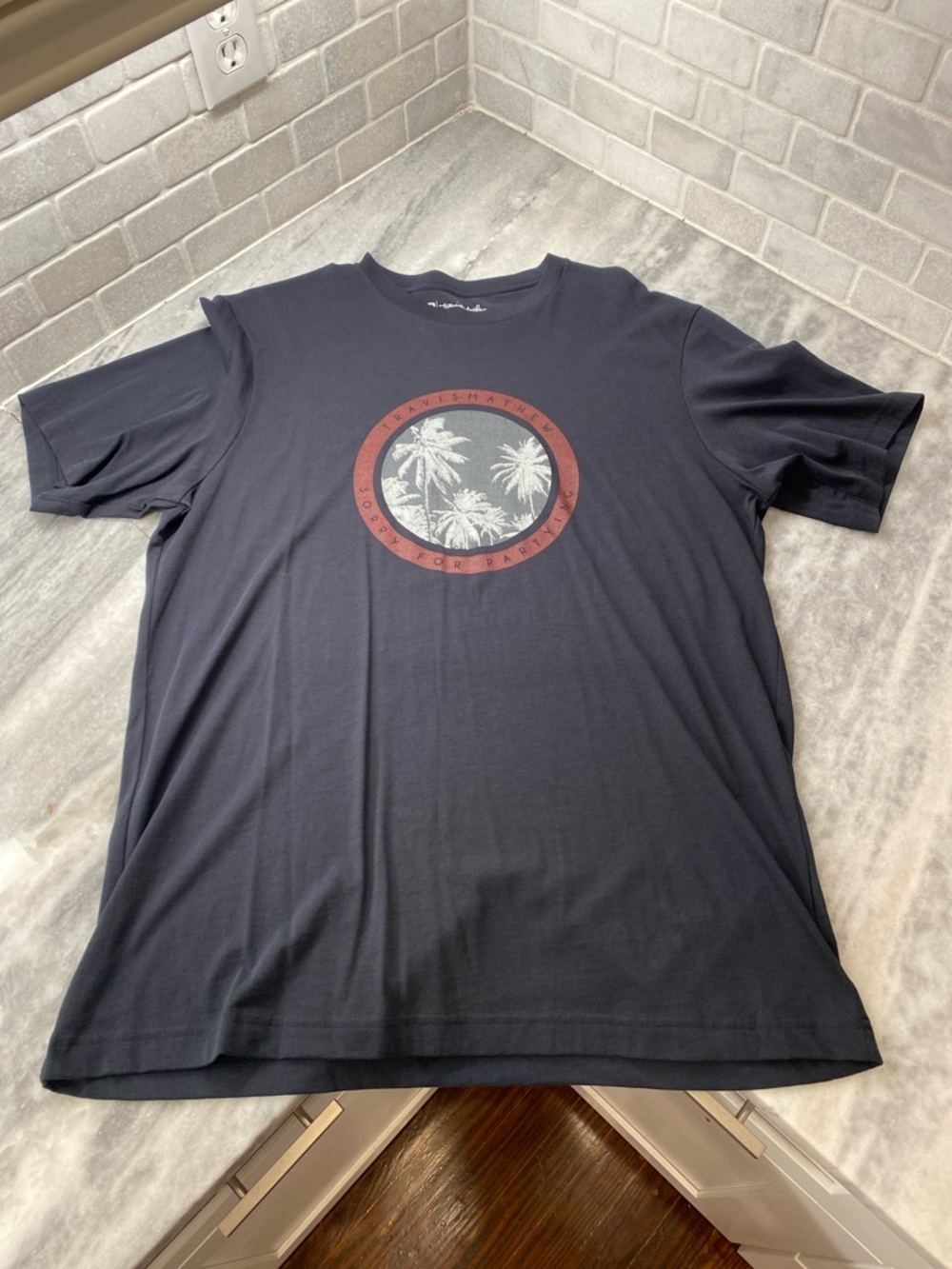 Travis Mathew Black Short-Sleeve Palm Graphic Tee with Red Accent